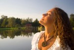 girl-lake-sun Girl breathing by lake